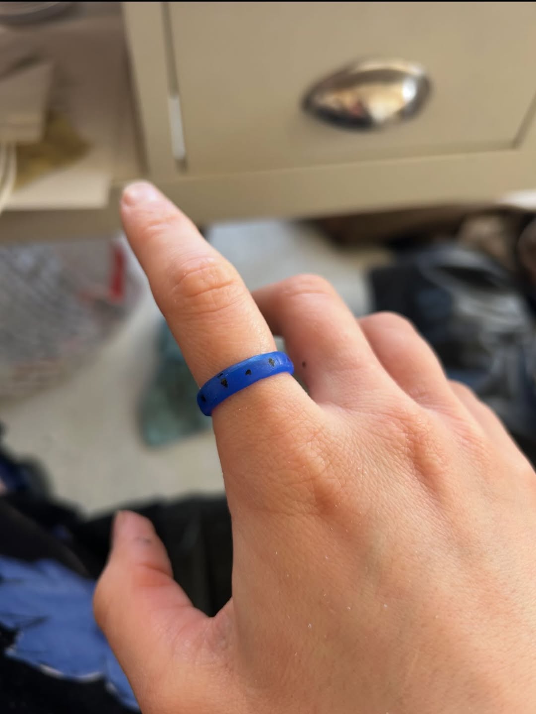 The wax ring model worn on the maker's hand to check the fit